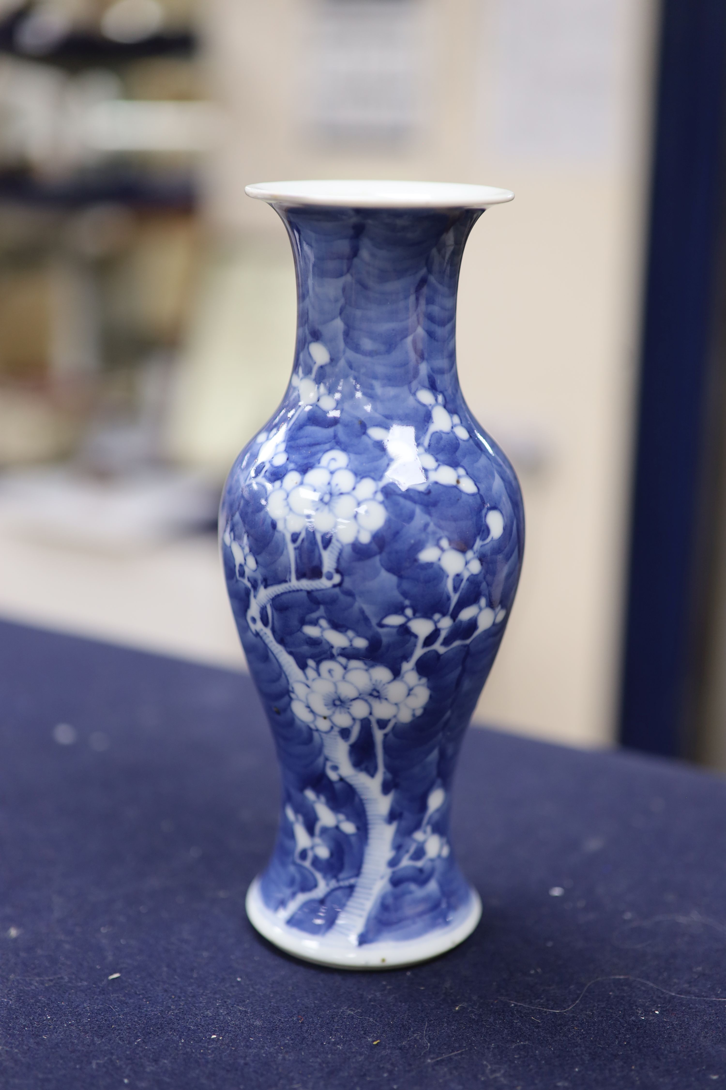 Two Chinese blue and white vases and a dish, together with a famille rose dish, tallest 28cm